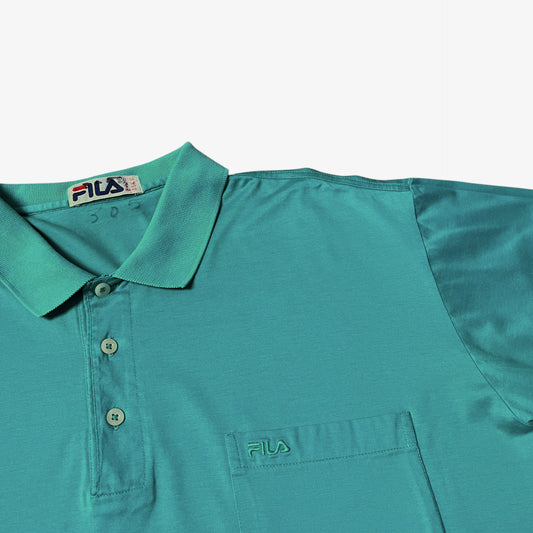 Fila embroidered spell out on a vintage 80s men's green polo shirt.