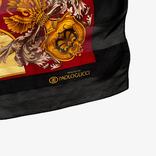 Paolo Gucci logo on a vintage 80s women's black and yellow striped silk scarf features a golden baroque print.