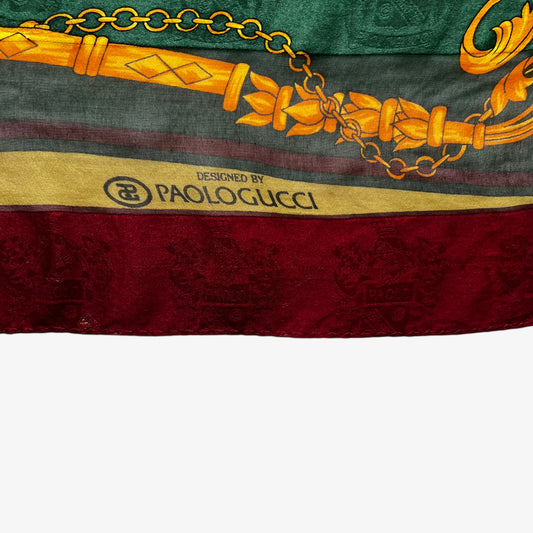 Paolo Gucci spell out logo on vintage 80s women's equestrian buckle and embossed crest print silk scarf featuring a green and red stripe.