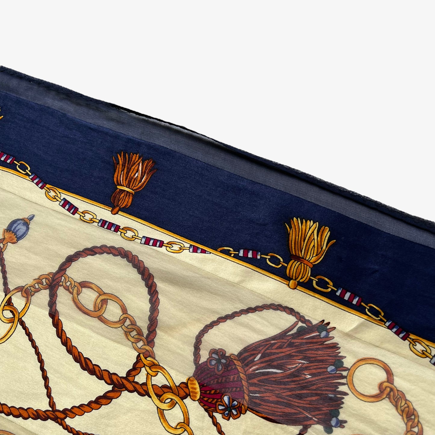 Patina on women's vintage 90s Paolo Gucci Sam Whan medallion chain and green tartan print navy silk scarf.