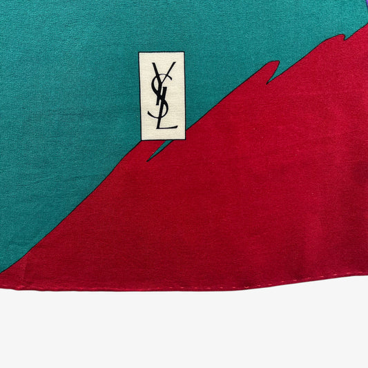 YSL motif of women's vintage 80s Yves Saint Laurent colourful abstract print green silk scarf.