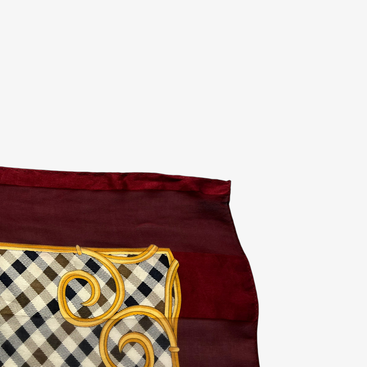 Patina on a women's vintage 90s Aquascutum of London colourful house checkered and baroque heart patterned red silk scarf.