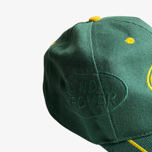 Embroidered spell out on the side of vintage 90s Land Rover green cap.