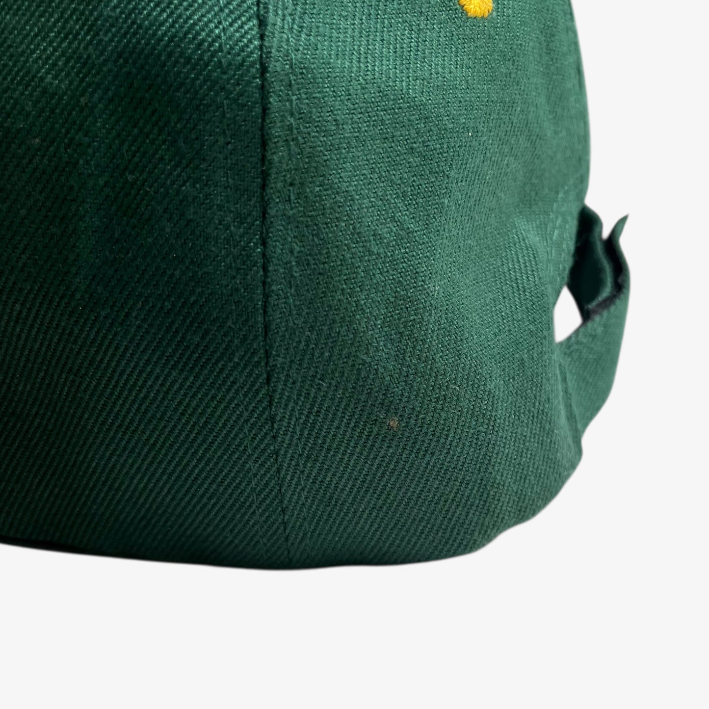 Patina on vintage 90s Land Rover embroidered green cap.