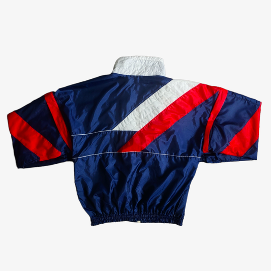 Back of vintage 90s Adidas England template track jacket in navy, red, and white colours with a geometric pattern.