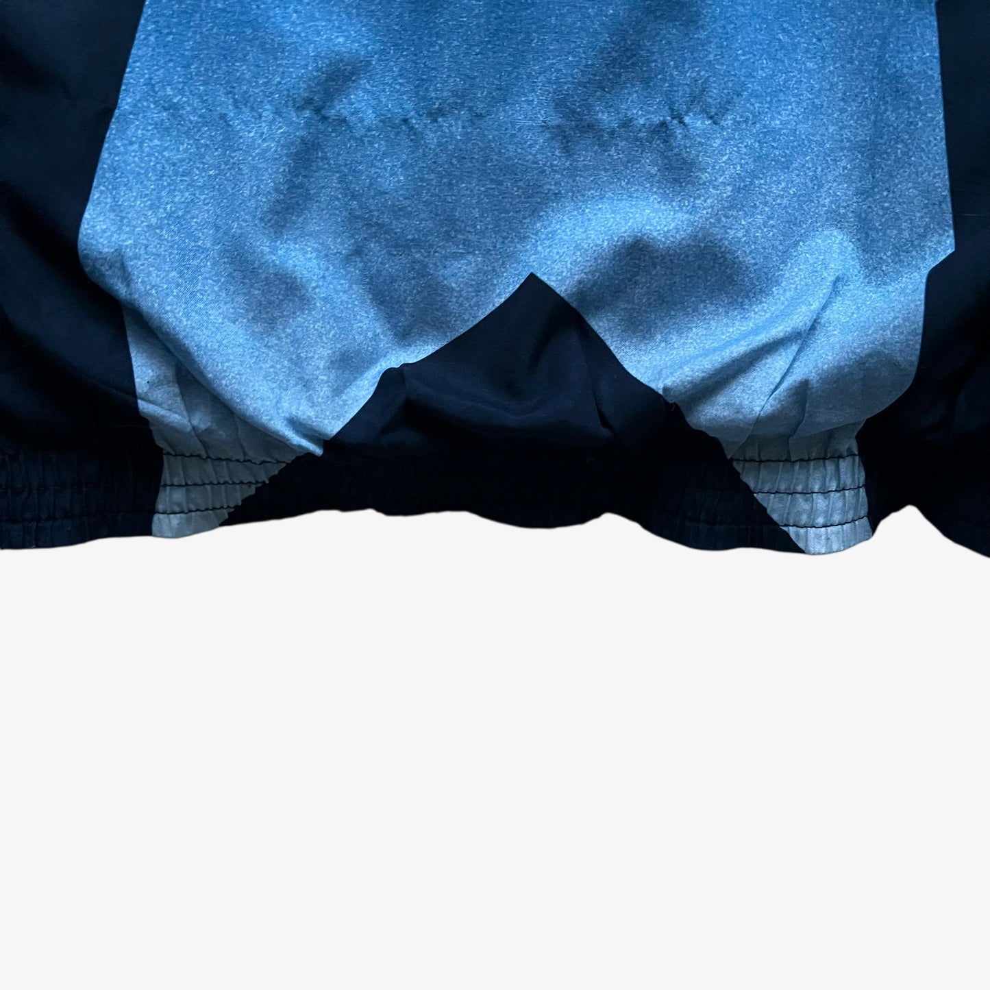 Patina on hem of vintage 90s men's Champion 1996 USA Olympic team star print navy track jacket.