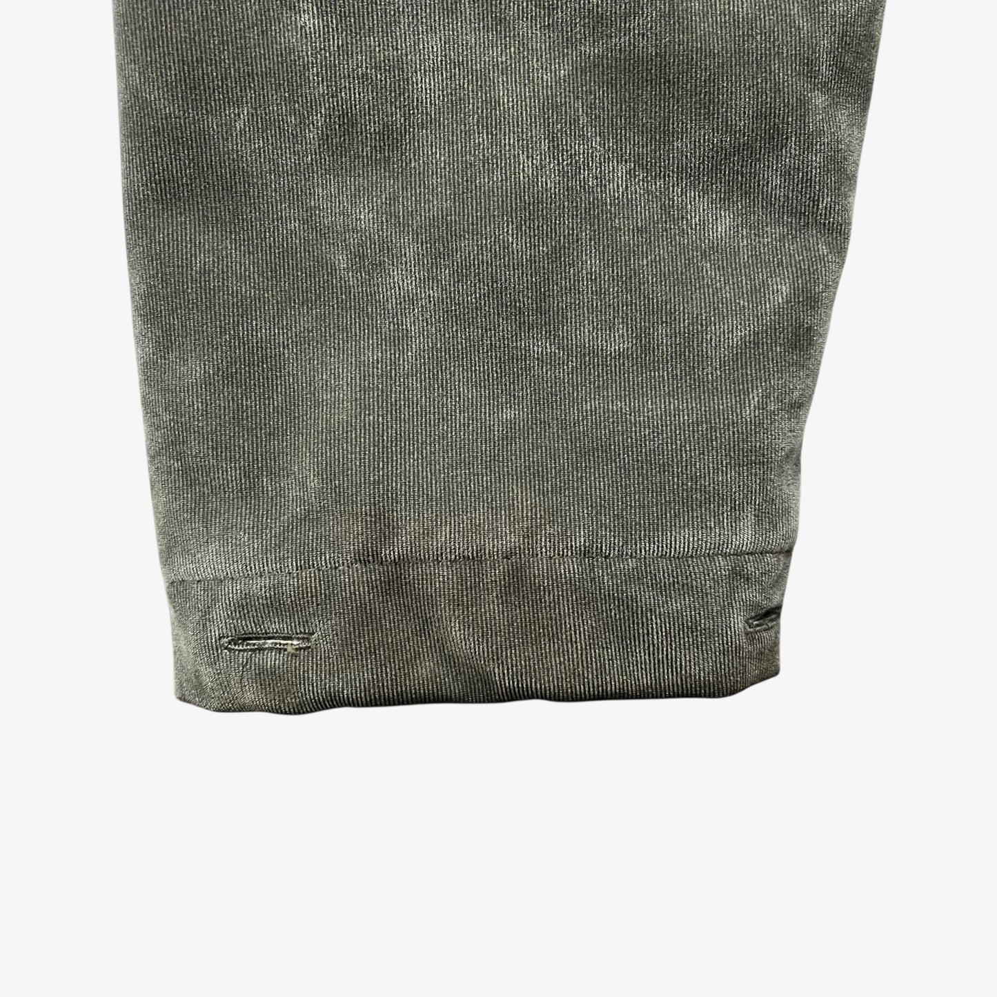 Cuff of a vintage 90s men's Gianfranco Ferre Jeans khaki ribbed jacket.
