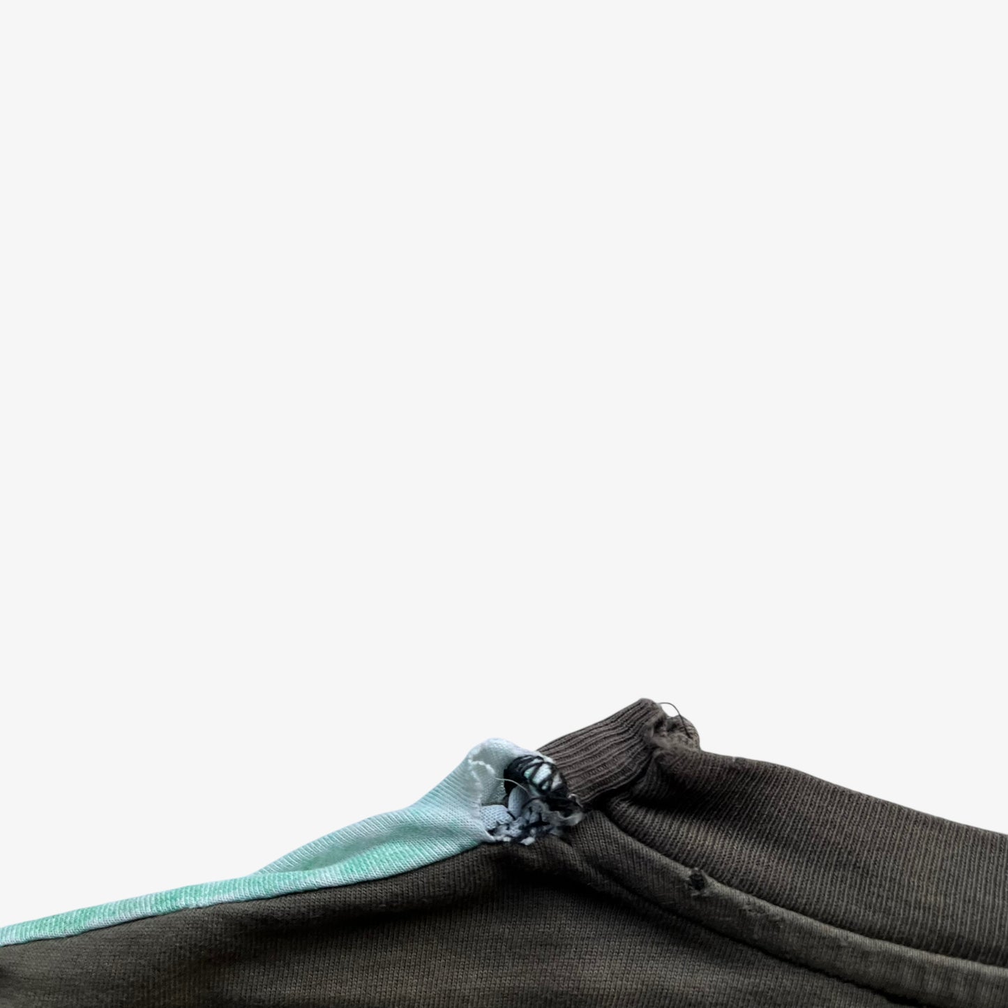 Collar of men's vintage 90s Moschino Jeans no war but love cowboy print t-shirt.