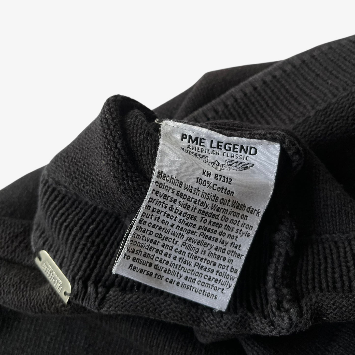 Inside label of vintage 90s men's Pall Mall PME legend American classic black knitted jumper.
