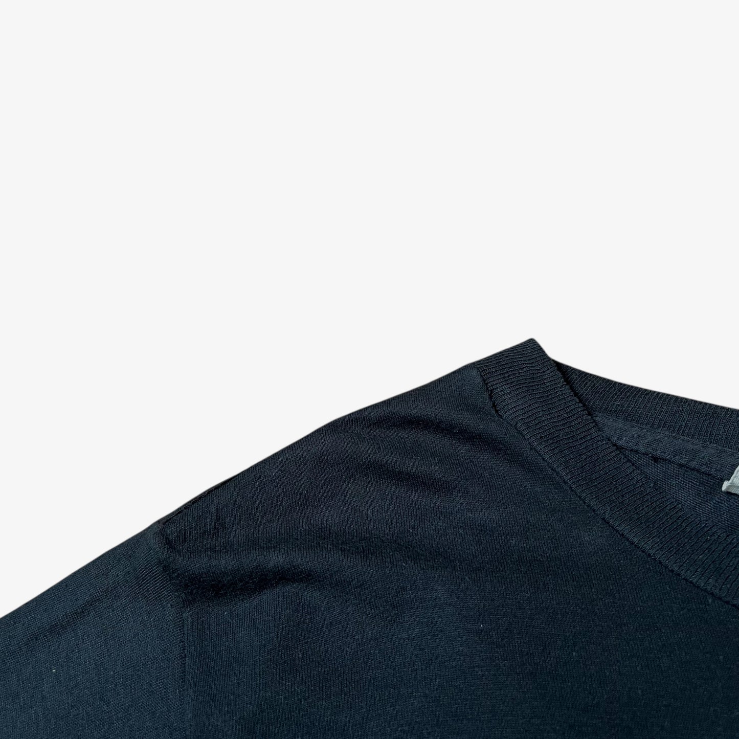 Wear on collar of vintage 90s men's Screen Stars MTV Jackass Johnny Knoxville print black single stitch t-shirt.