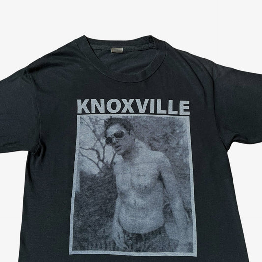 Close up of MTV Jackass Johnny Knoxville print on a vintage 90s men's Screen Stars black single stitch t-shirt.