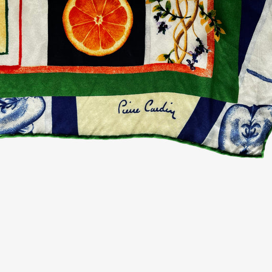Pierre Cardin spell out logo on women's vintage 90s colourful floral and fruit print silk scarf.