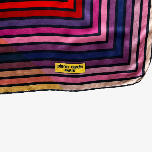 Pierre Cardin Paris spell out logo on women's vintage 90s colourful abstract striped print silk scarf.