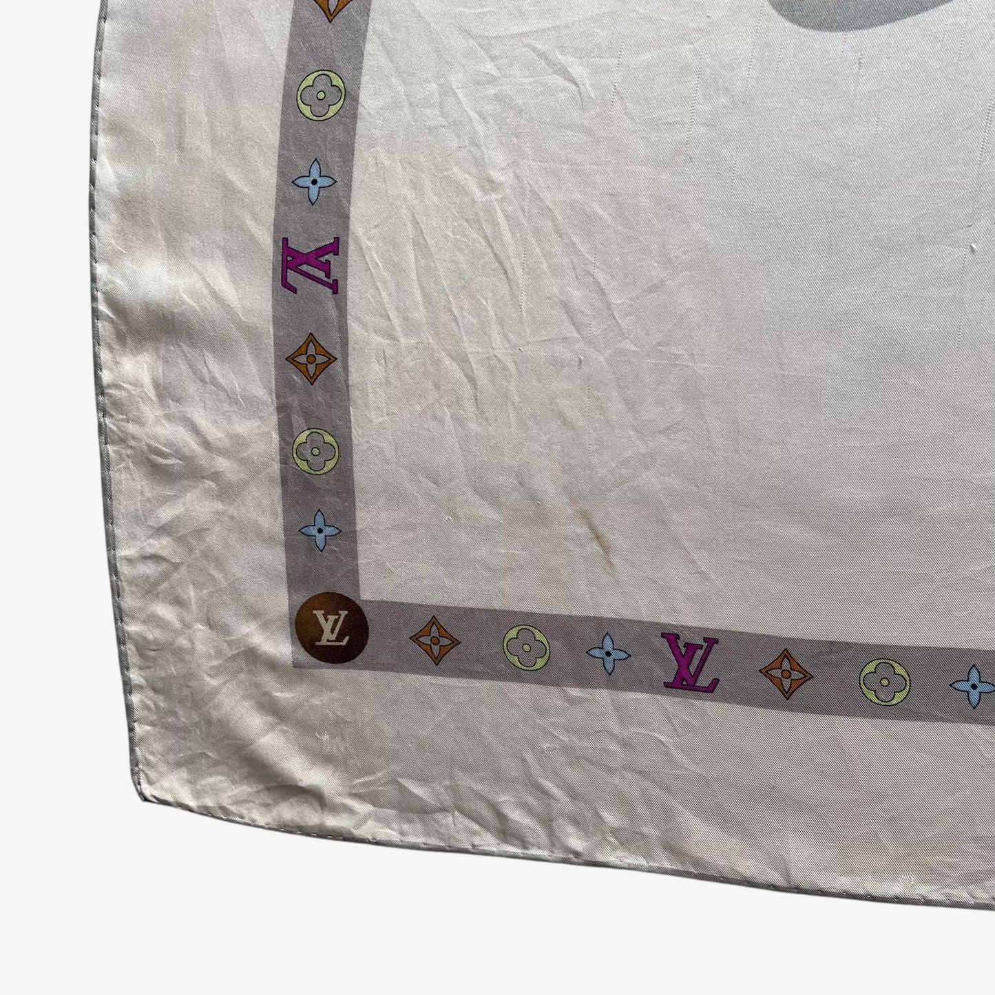 Patina on women's vintage Y2K Louis Vuitton beige silk scarf featuring an LV spell out and solar system print.