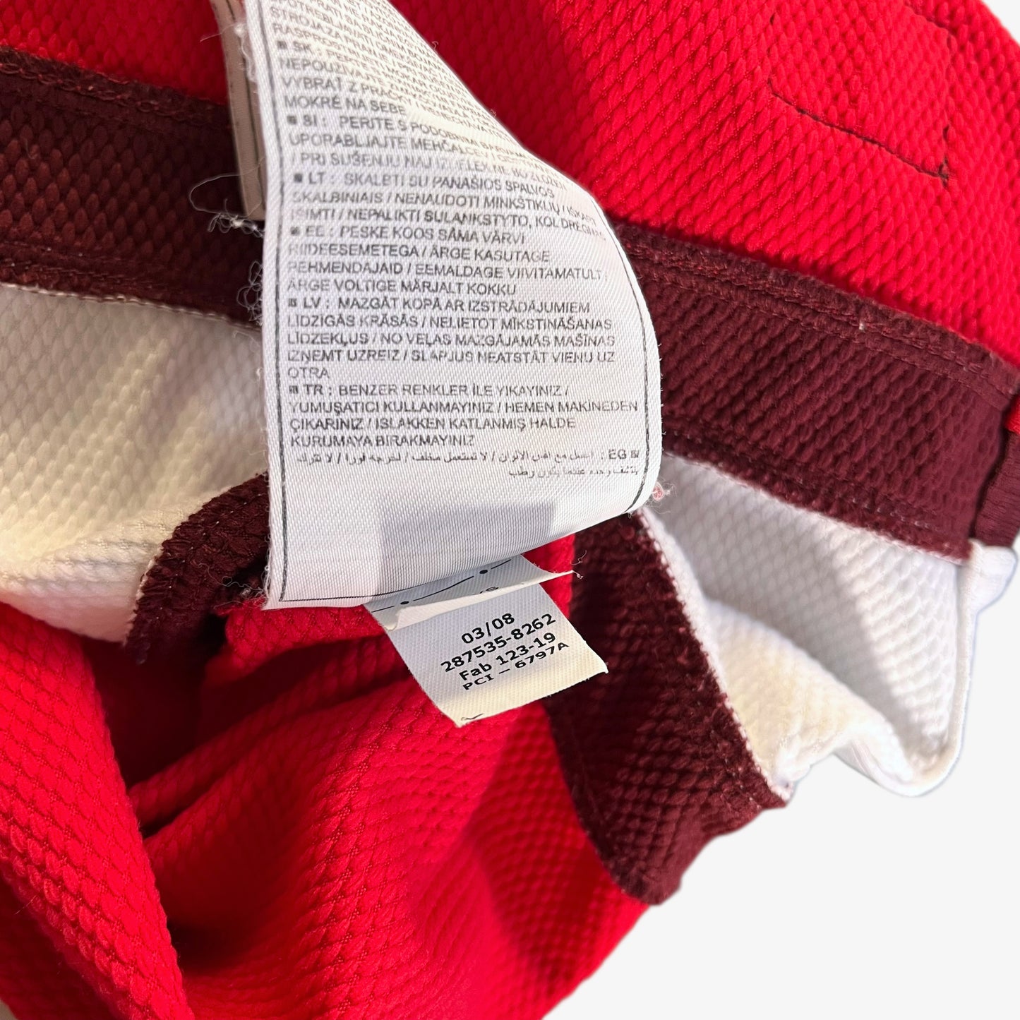 Inside label of vintage men's Nike Arsenal 2008 - 2010 red home football jersey.