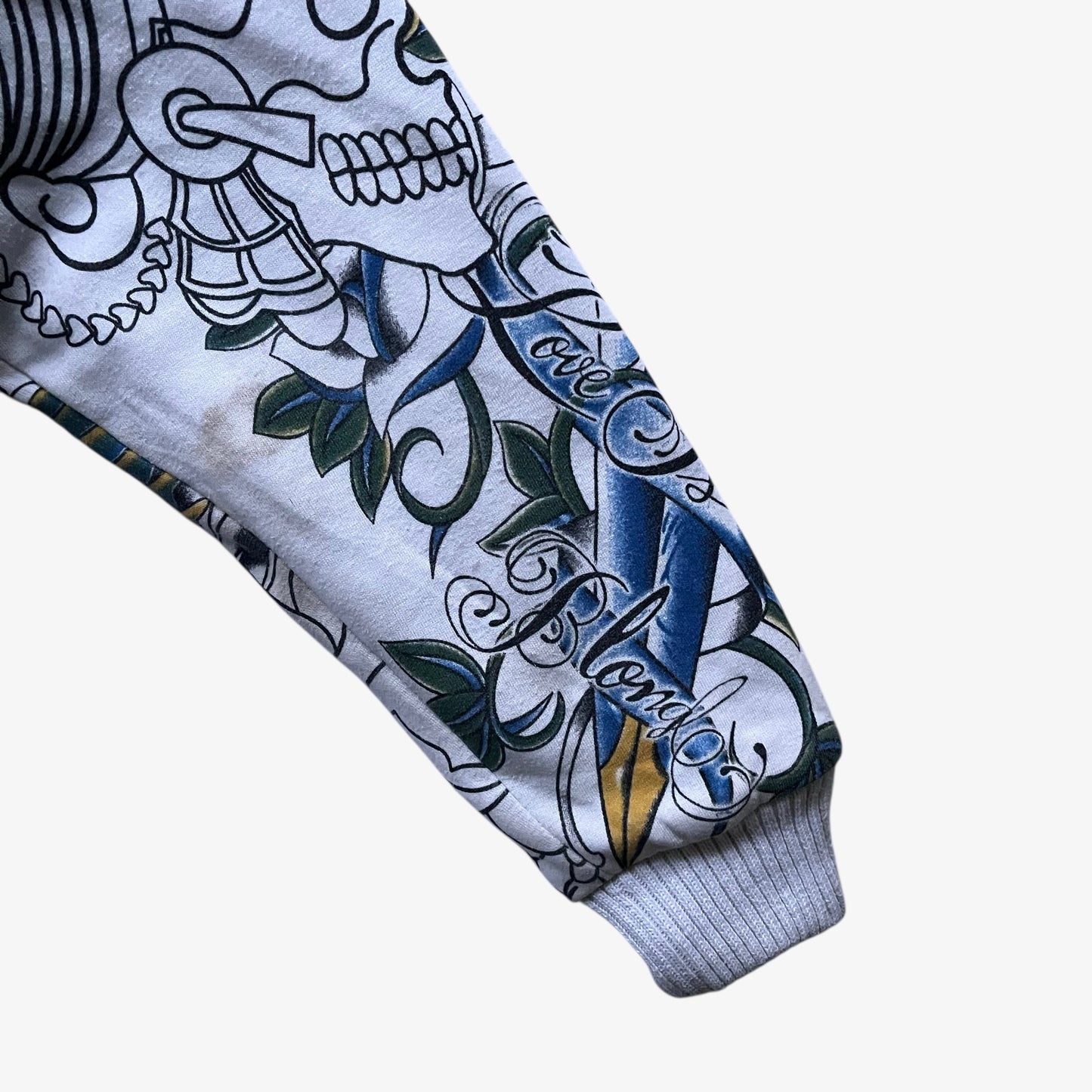 Patina on the sleeve of vintage Y2K men's Really Point skull and sword double sided print white jacket.