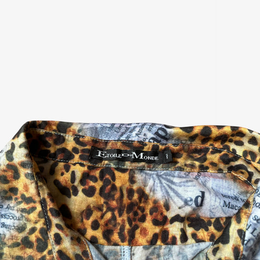 Etoile Du Monde label stitched inside of a vintage Y2K women's leopard and newspaper print shirt.