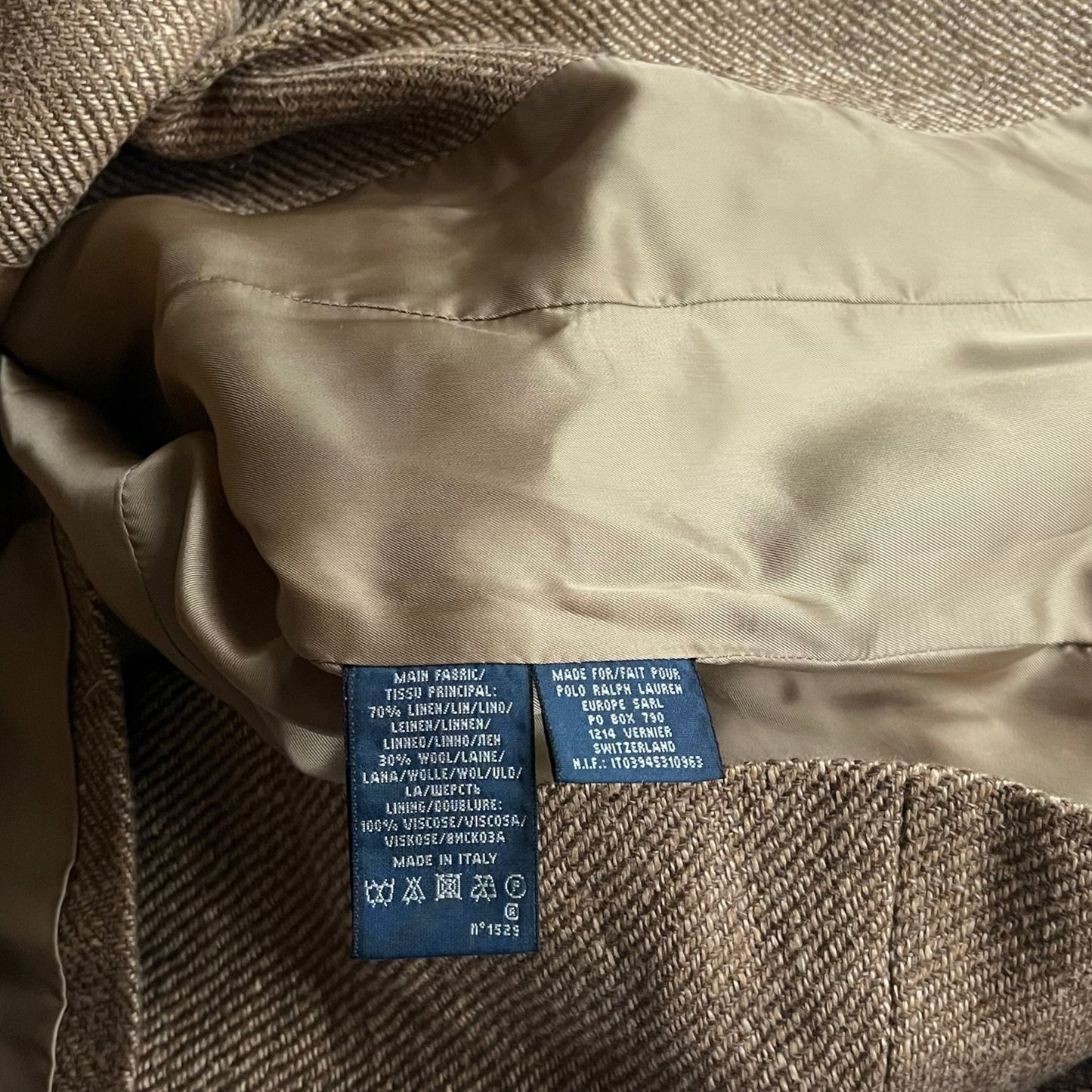 Made in Italy material label inside of a women's vintage Y2K Ralph Lauren brown linen and wool herringbone blazer.