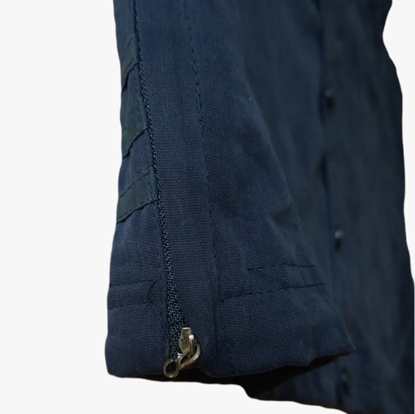 Zipper on vintage 90s men's Adidas Equipment navy tactical vest.