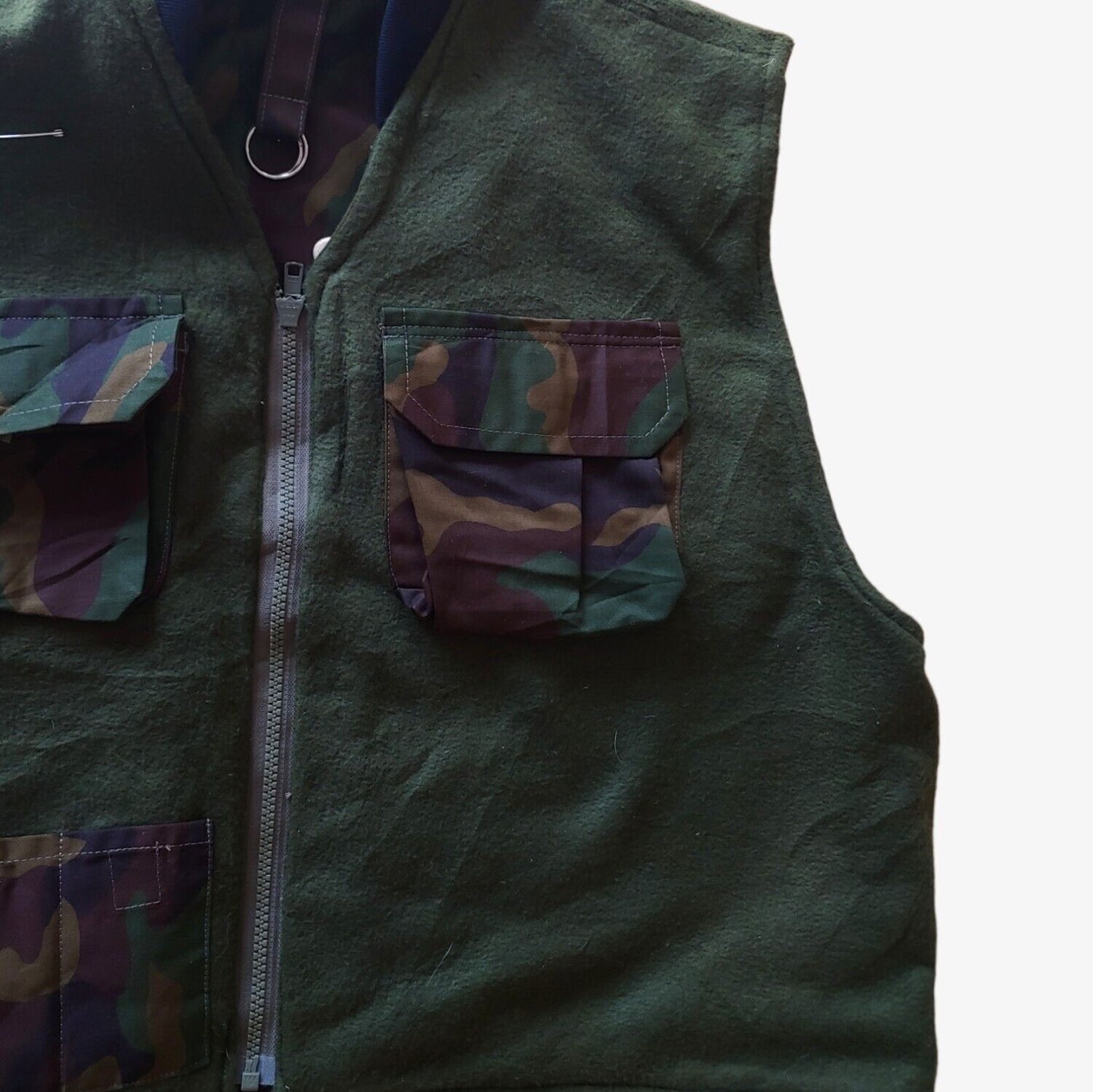 Inside pocket of vintage 90s New Contrast camouflage hunting utility gilet.
