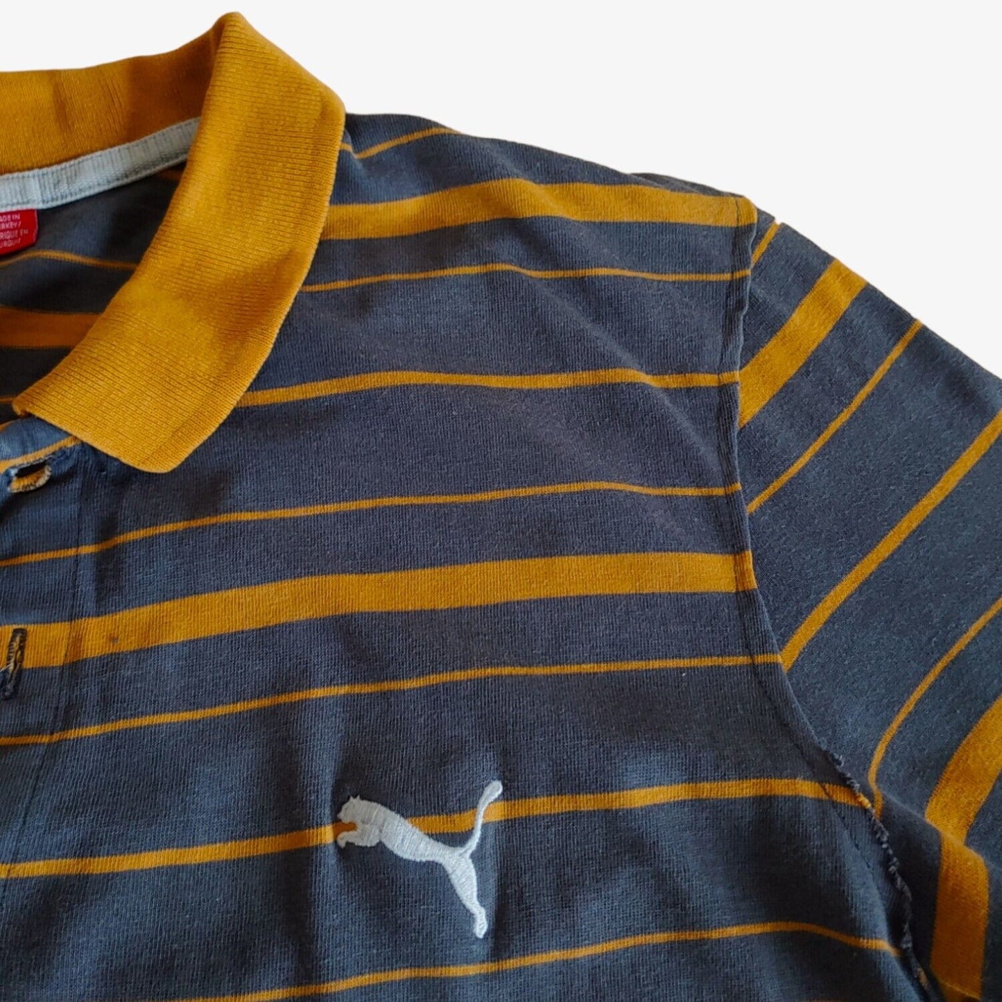Embroidered Puma logo on vintage Manu Samoa New Zealand striped polo shirt.