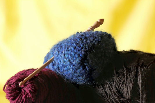 Close up of colourful rolls of wool.