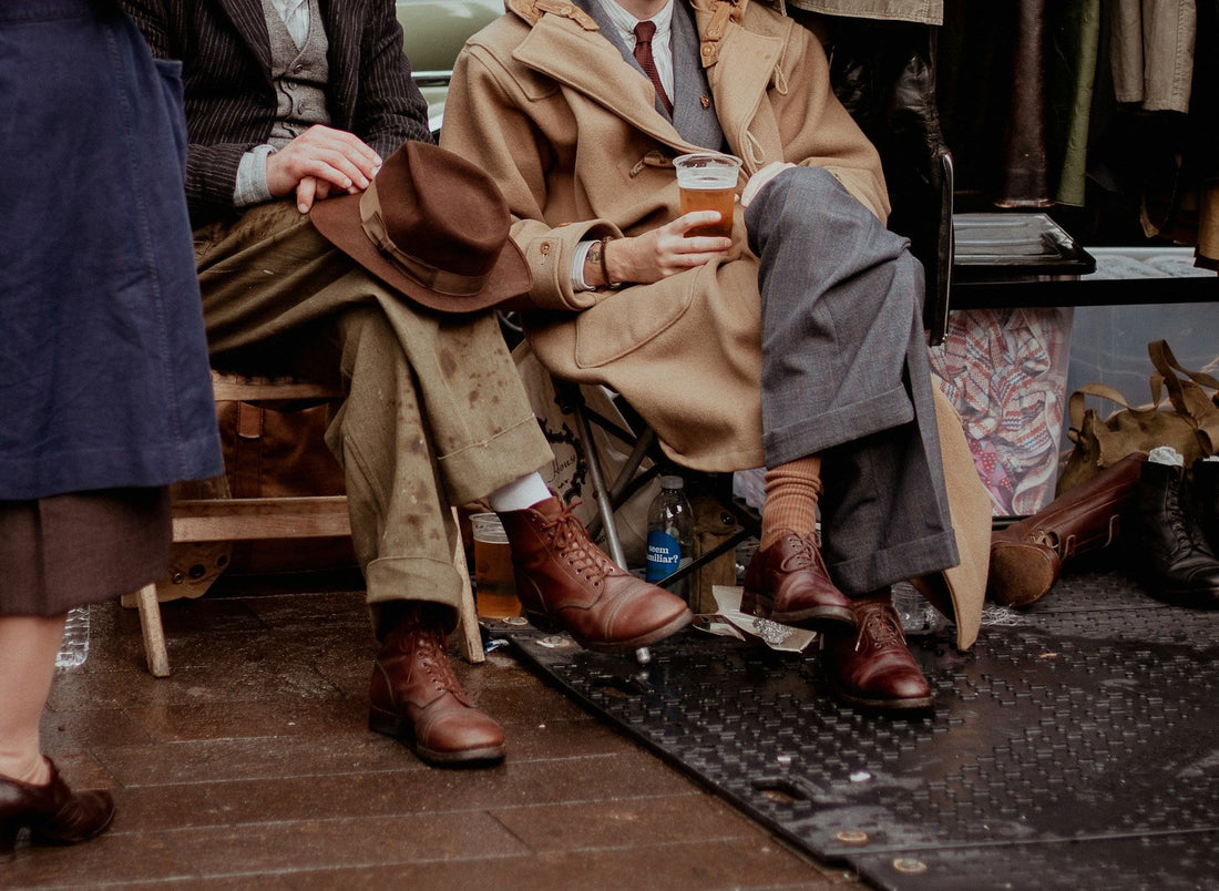 Two male models wearing a vintage 80s oversized suit with a 90s wool coat.