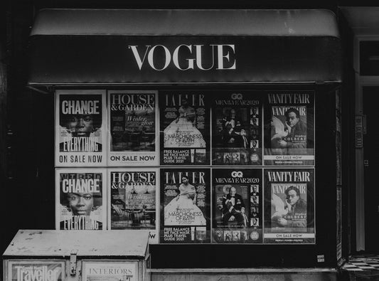 Close up of Vogue fashion magazine's cover art being shown in a vintage store.
