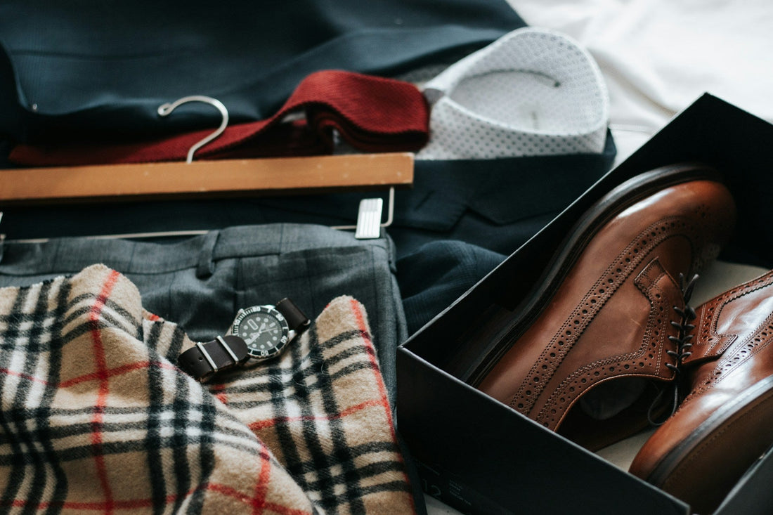 Close up of a vintage men's outfit, including a retro 80s Burberry nova check wool scarf and designer suit.