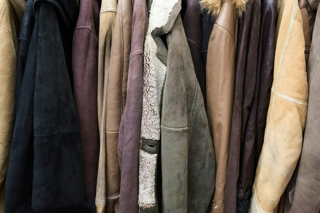 Rail filled with a variety of vintage leather jackets and coats.