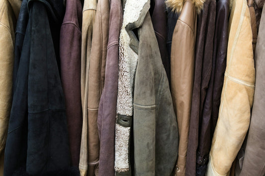 Rail filled with a variety of vintage leather jackets and coats.