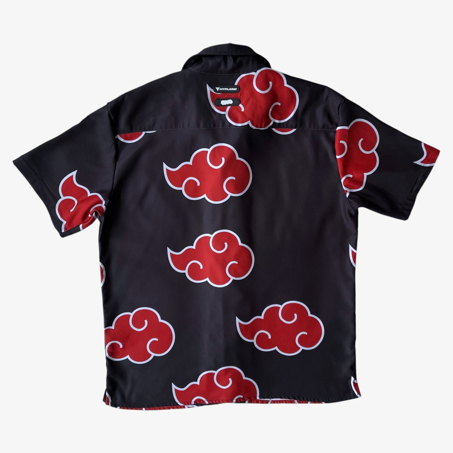 Back of Hypland black shirt with Naruto Akatsuki red cloud patterns on a white background.