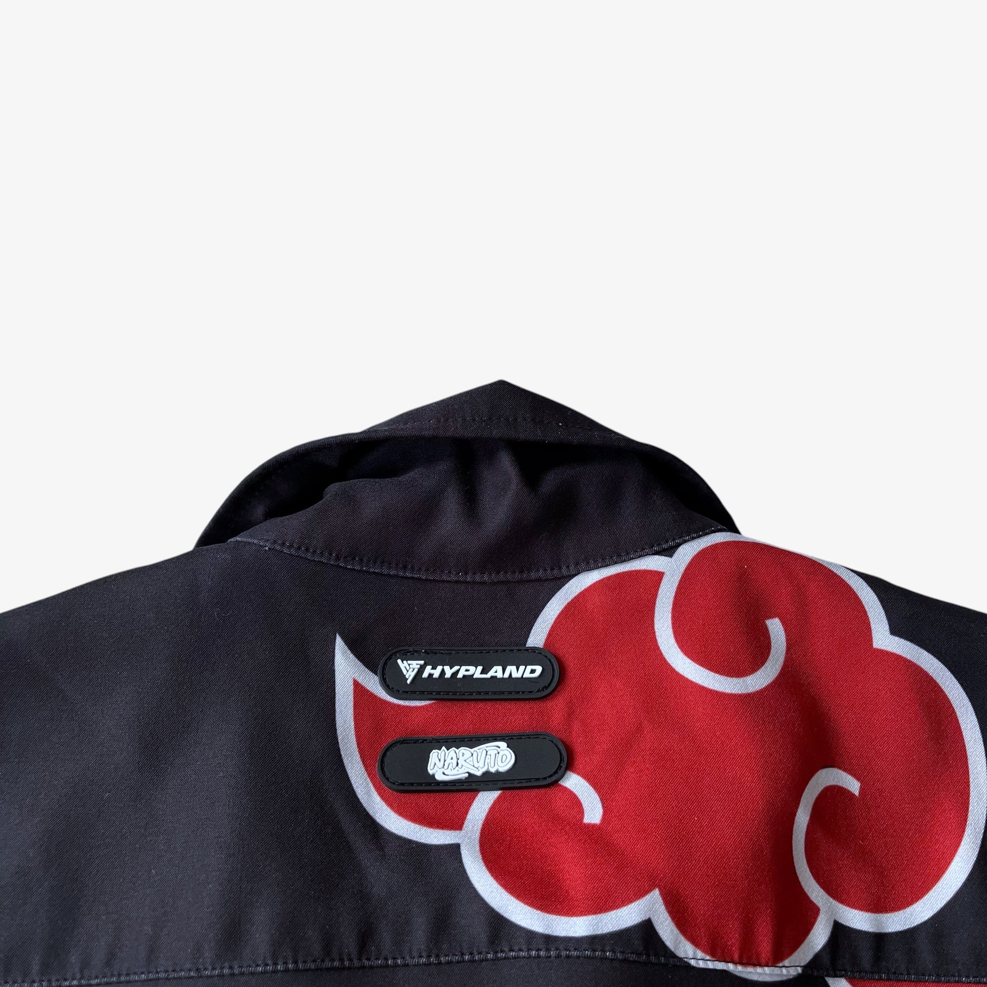 Black shirt with Akatsuki red cloud design and Hypland Naruto logo on a white background.