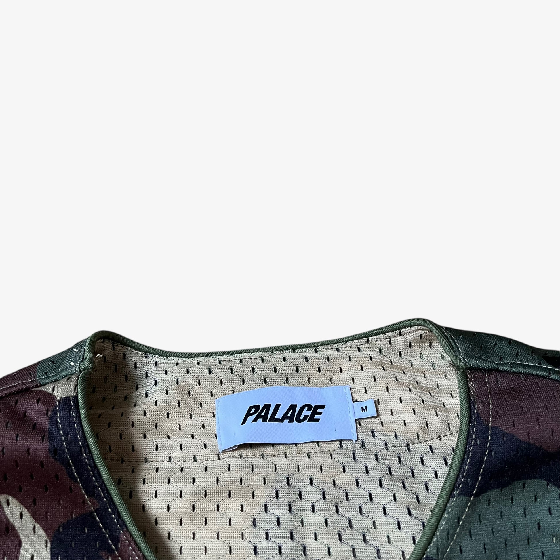 Palace label stitched inside of men's kawaii green camouflage baseball jersey.