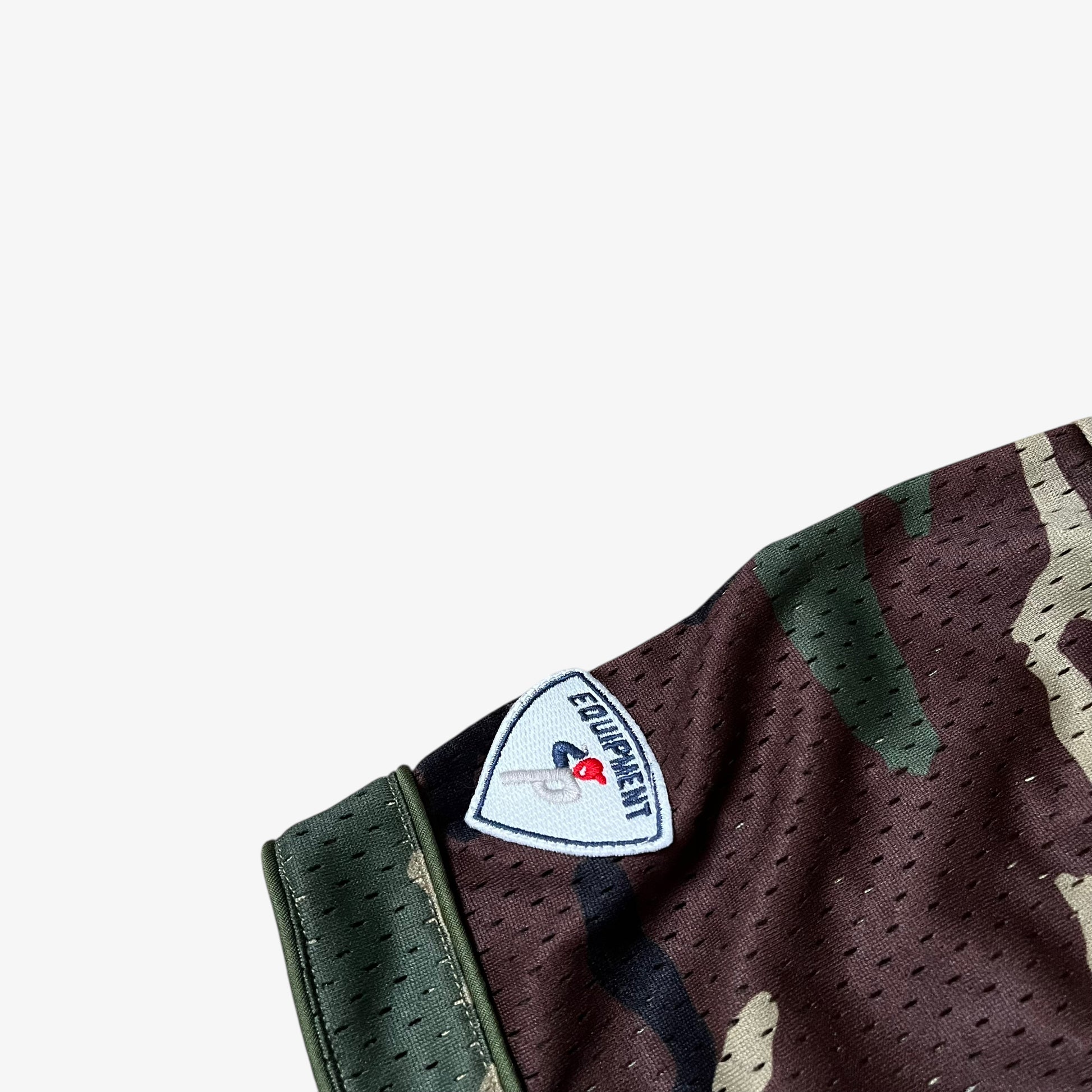 Embroidered MLB equipment logo on the sleeve of men's Palace kawaii green camouflage baseball jersey.