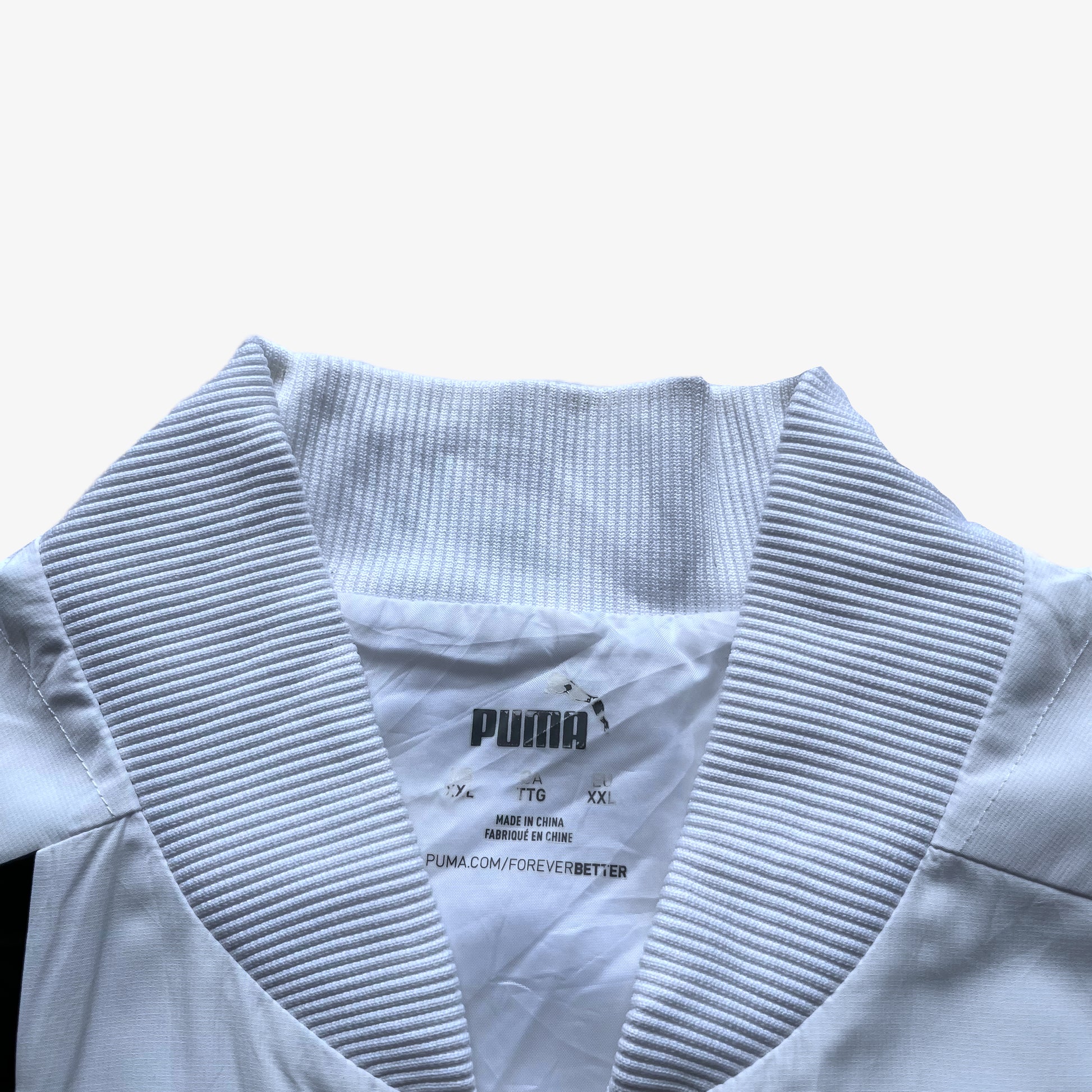 Puma label inside of men's Porsche 911 GT3R spell out print white driving jacket.