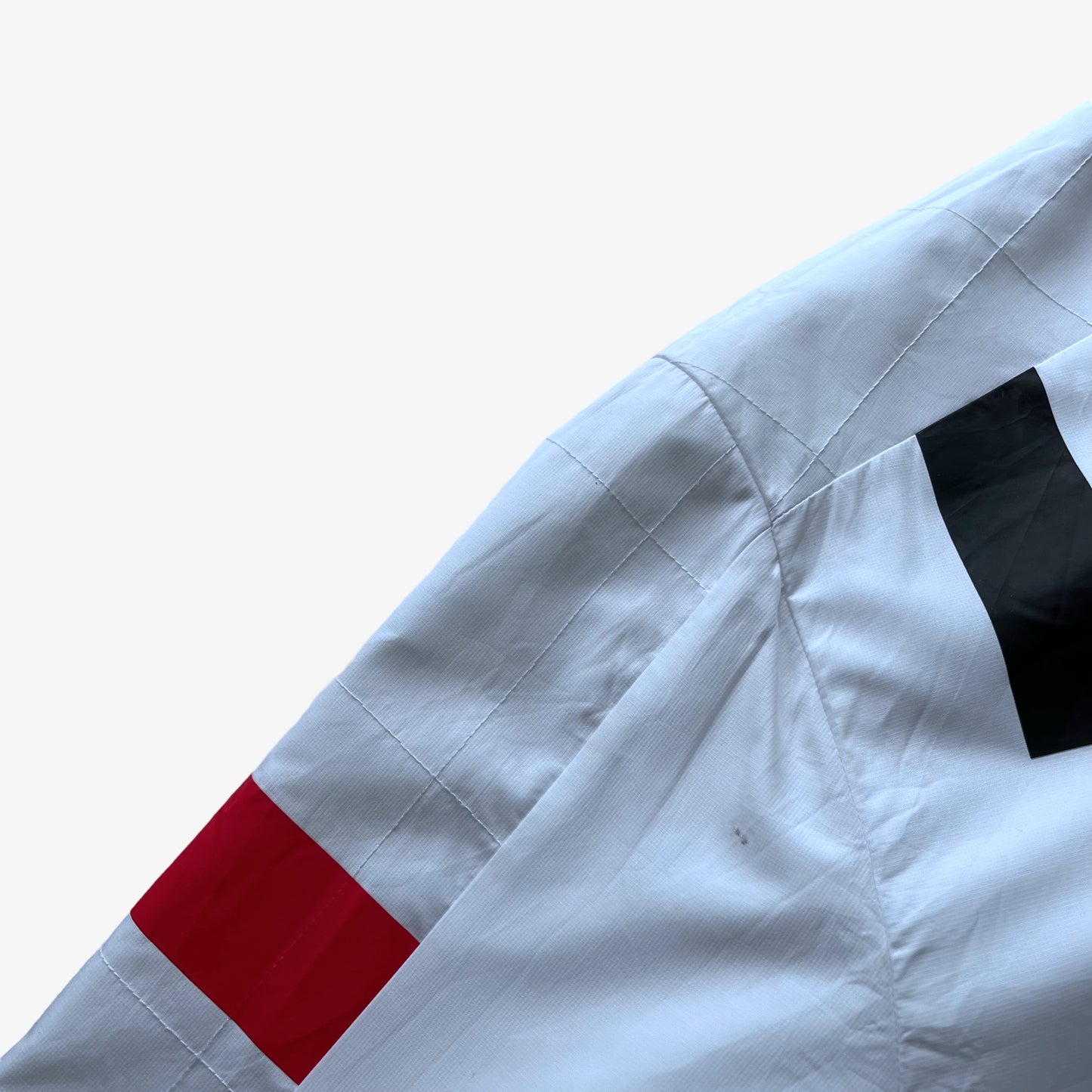 Patina on men's Puma Porsche 911 GT3R spell out print white driving jacket.