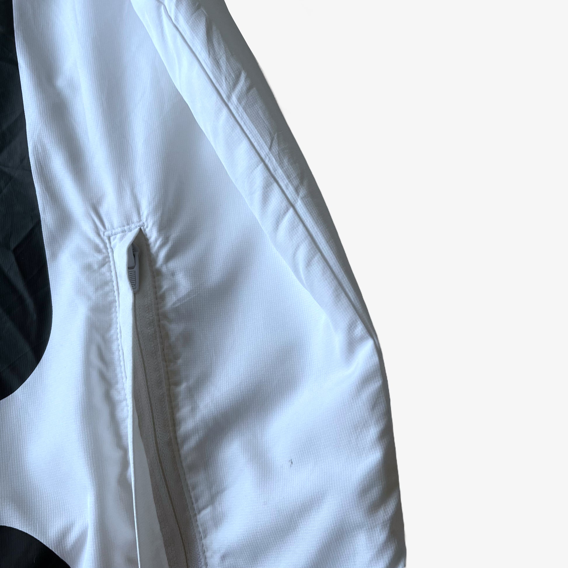 Zipped pocket on men's Puma Porsche 911 GT3R spell out print white driving jacket.