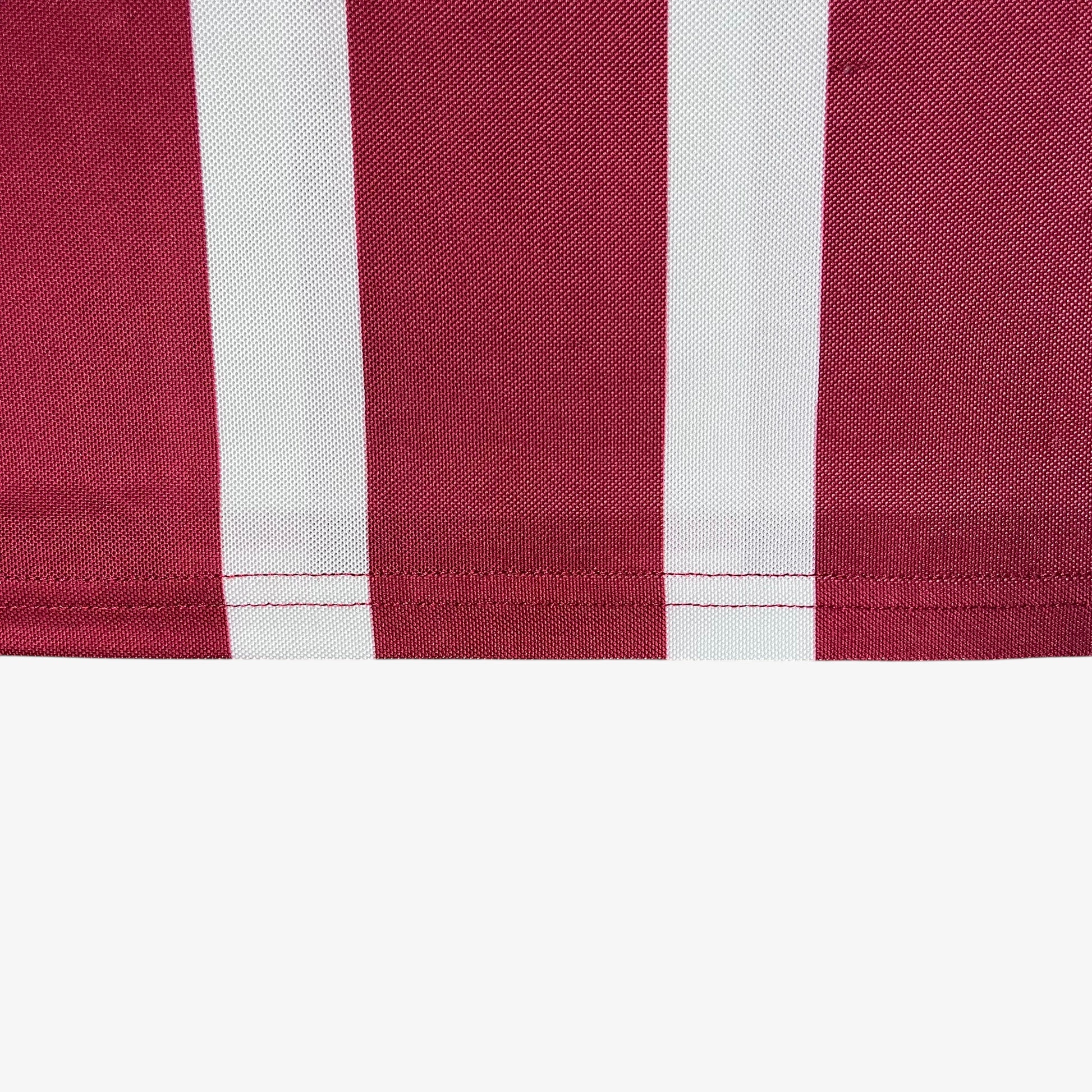 Cropped hem of men's Scuffers red and white striped football jersey.