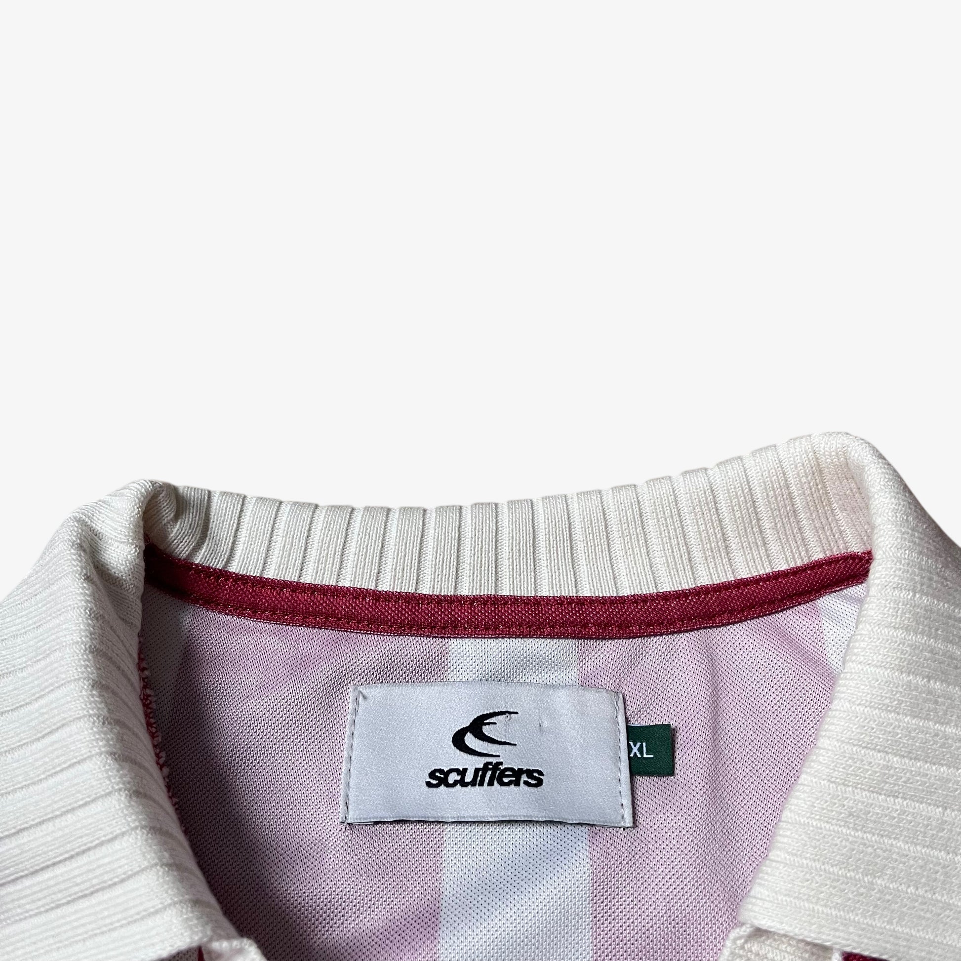 Scuffers label stitched inside of men's red and white striped football jersey.