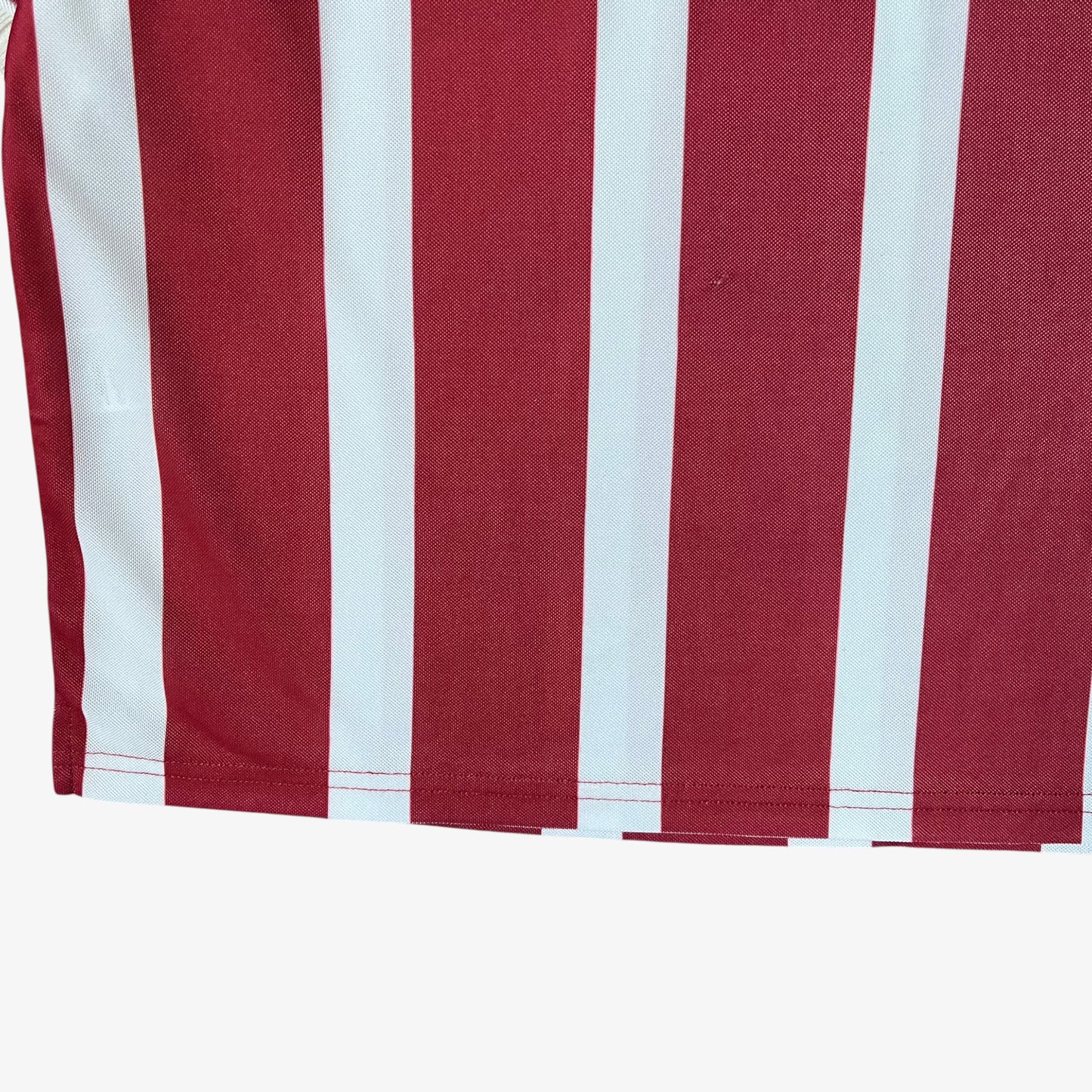Wear on men's Scuffers red and white striped football jersey.