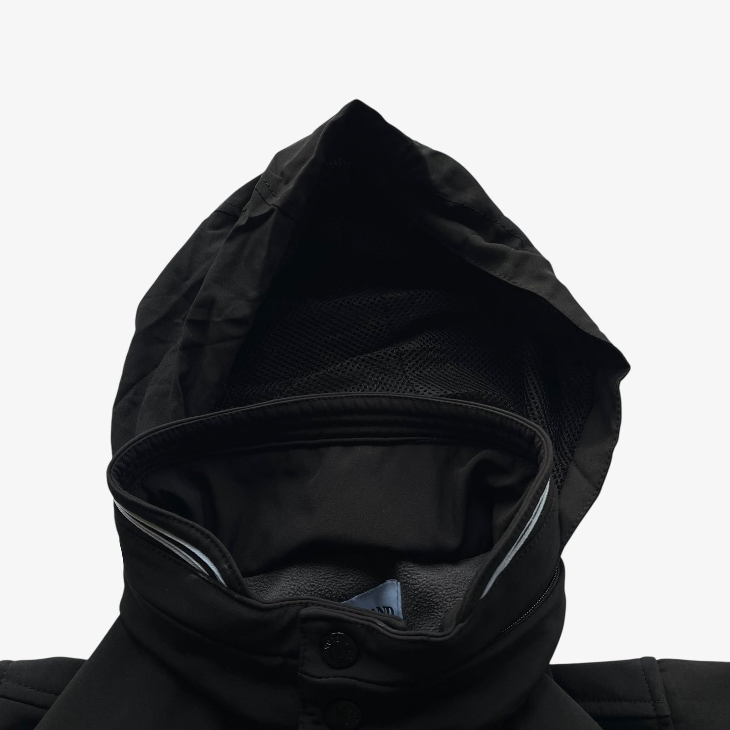 Foldable hood of men's Stone Island Soft Shell R black utility jacket.