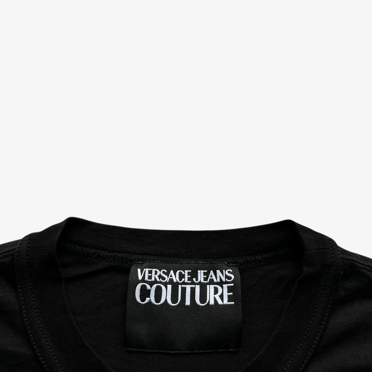 Versace Jeans Couture label stitched inside of men's rhinestone baroque sun face print black t-shirt.