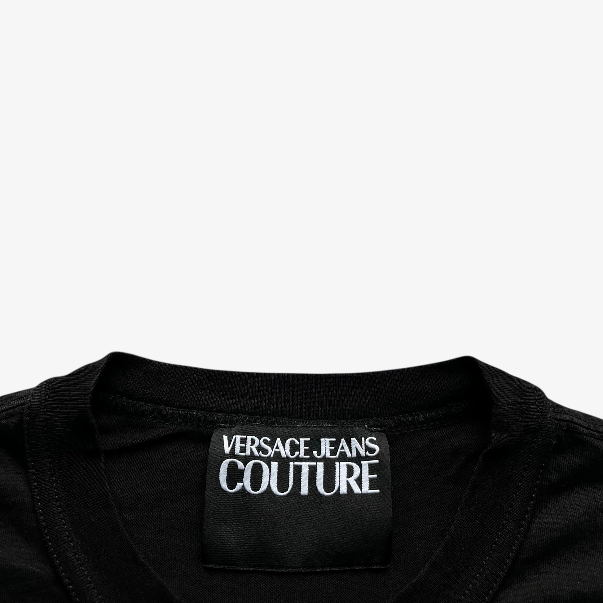 Versace Jeans Couture label stitched inside of men's rhinestone baroque sun face print black t-shirt.
