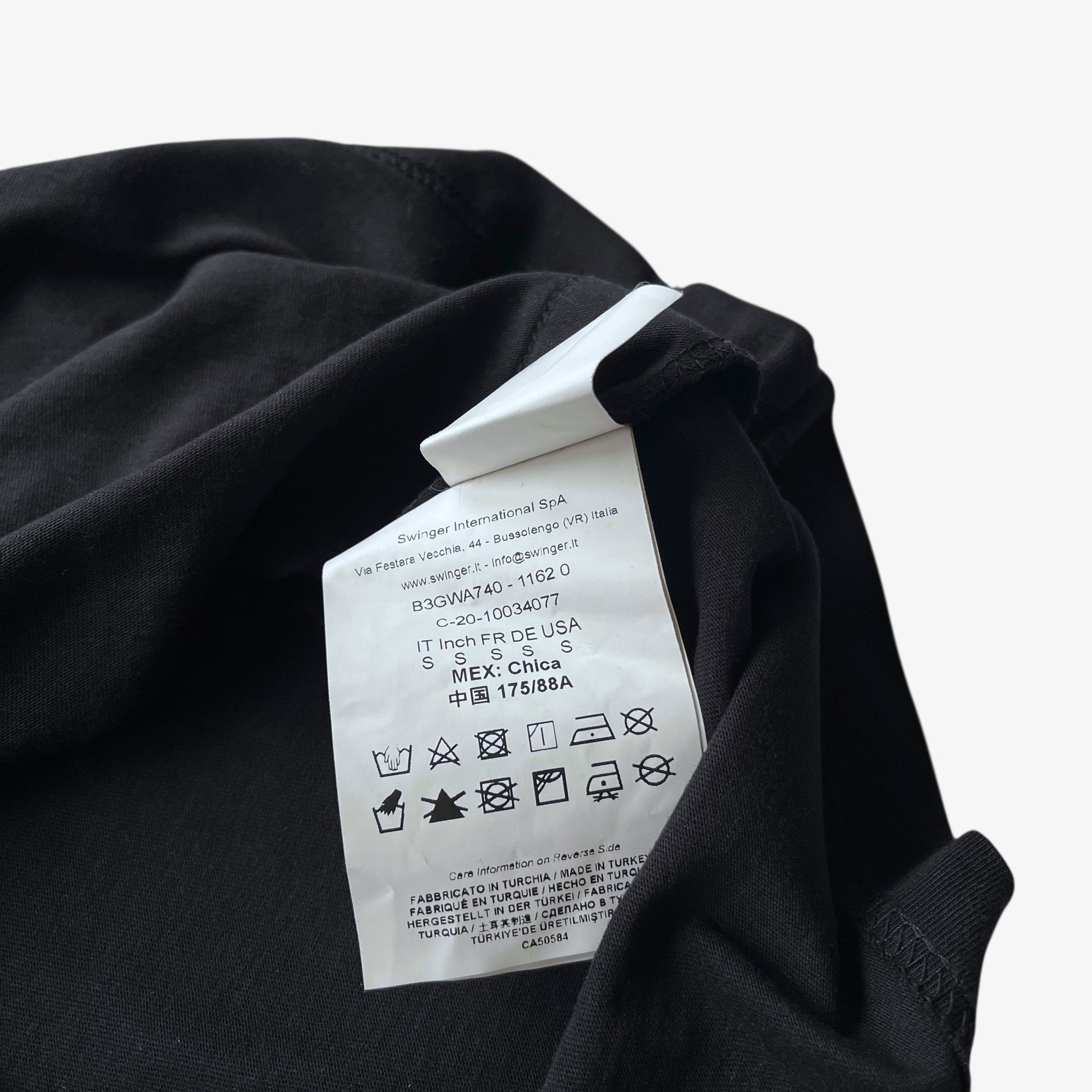 Swinger International SPA inside label of men's Versace Jeans Couture rhinestone baroque sun face print black t-shirt.