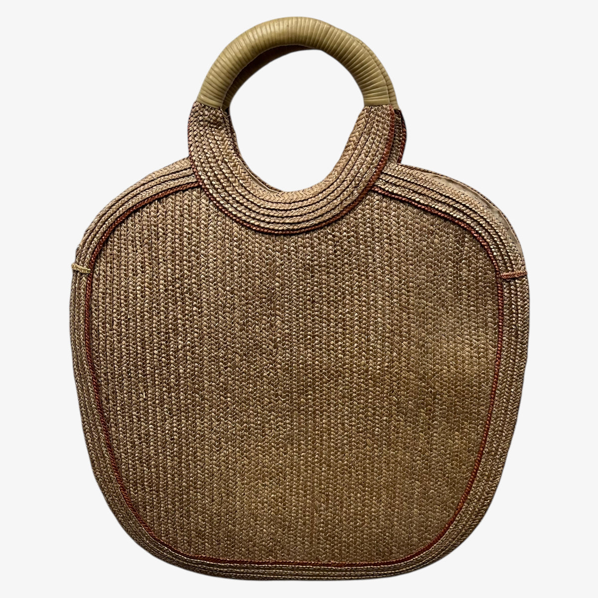 Back of a vintage 1950s crane and tree embroidered brown raffia tote bag on a white background.