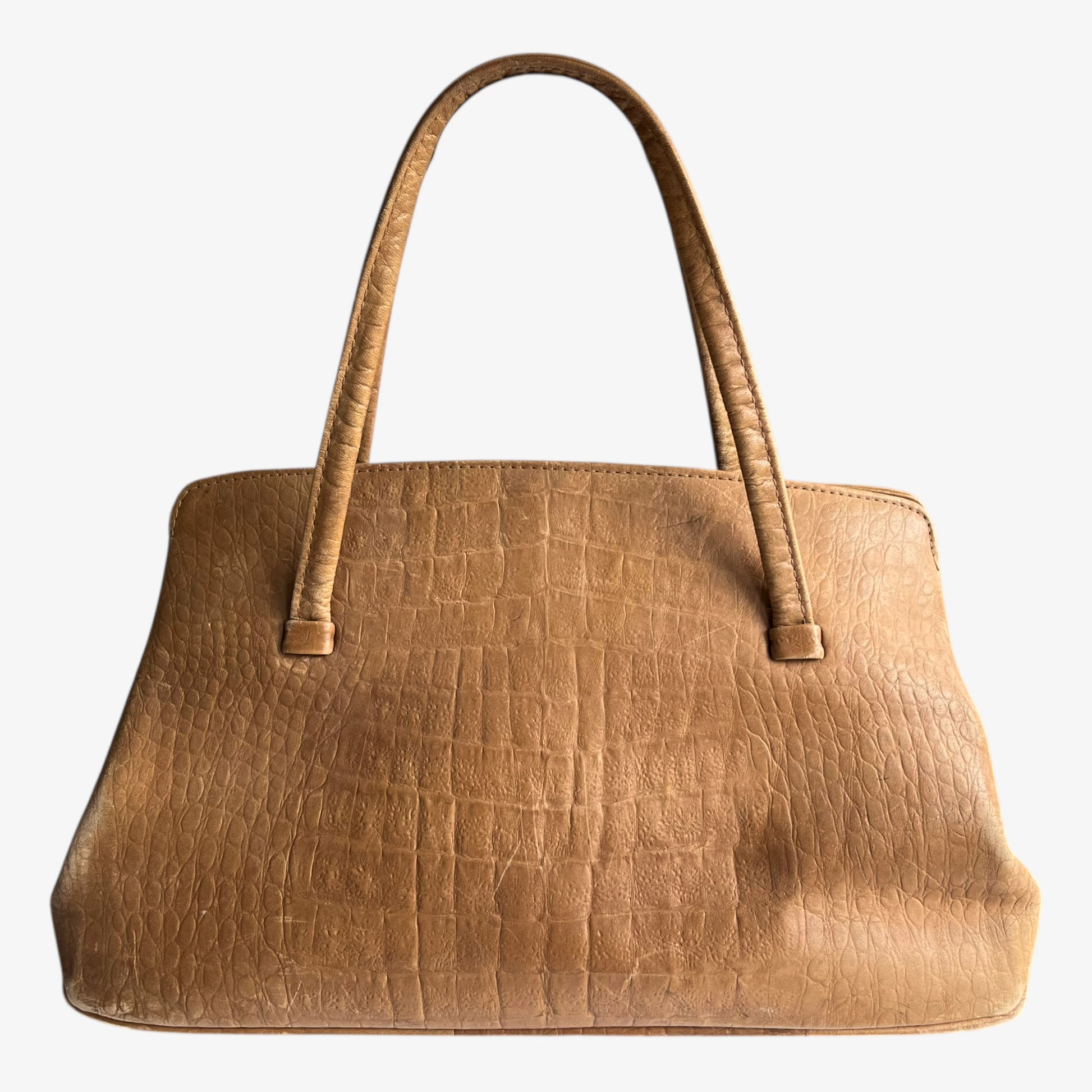 Vintage 1950s crocodile embossed light brown leather shoulder bag on a white background.