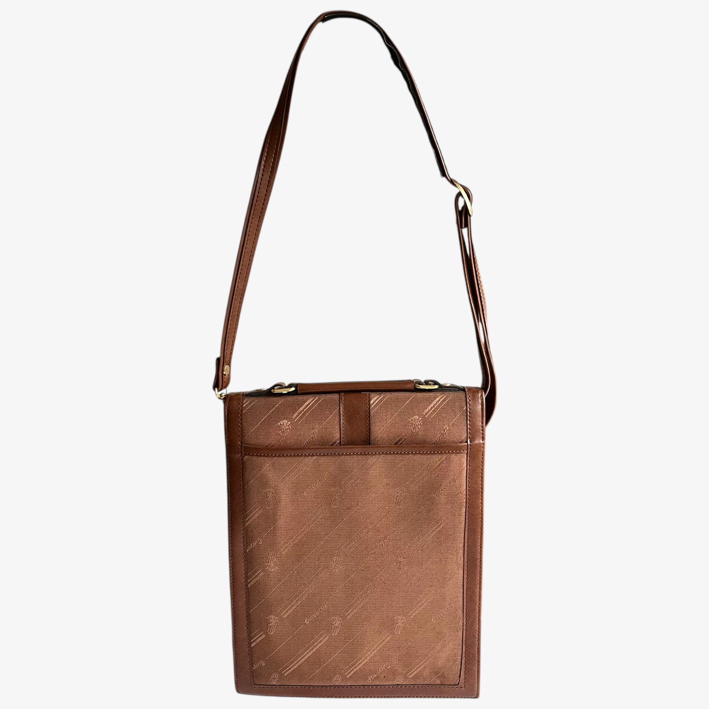 Back of vintage 1970s brown canvas and leather crossbody messenger bag with a monogram print on a white background.