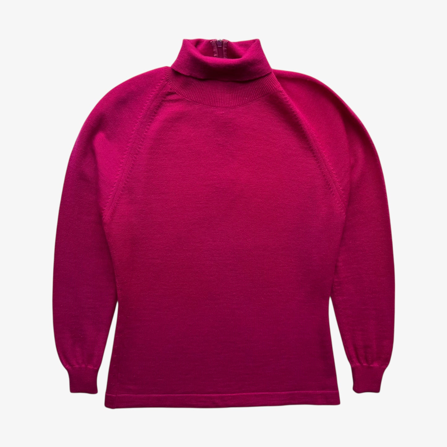 Vintage 60s women's Emilio Pucci pink turtleneck jumper on a white background.