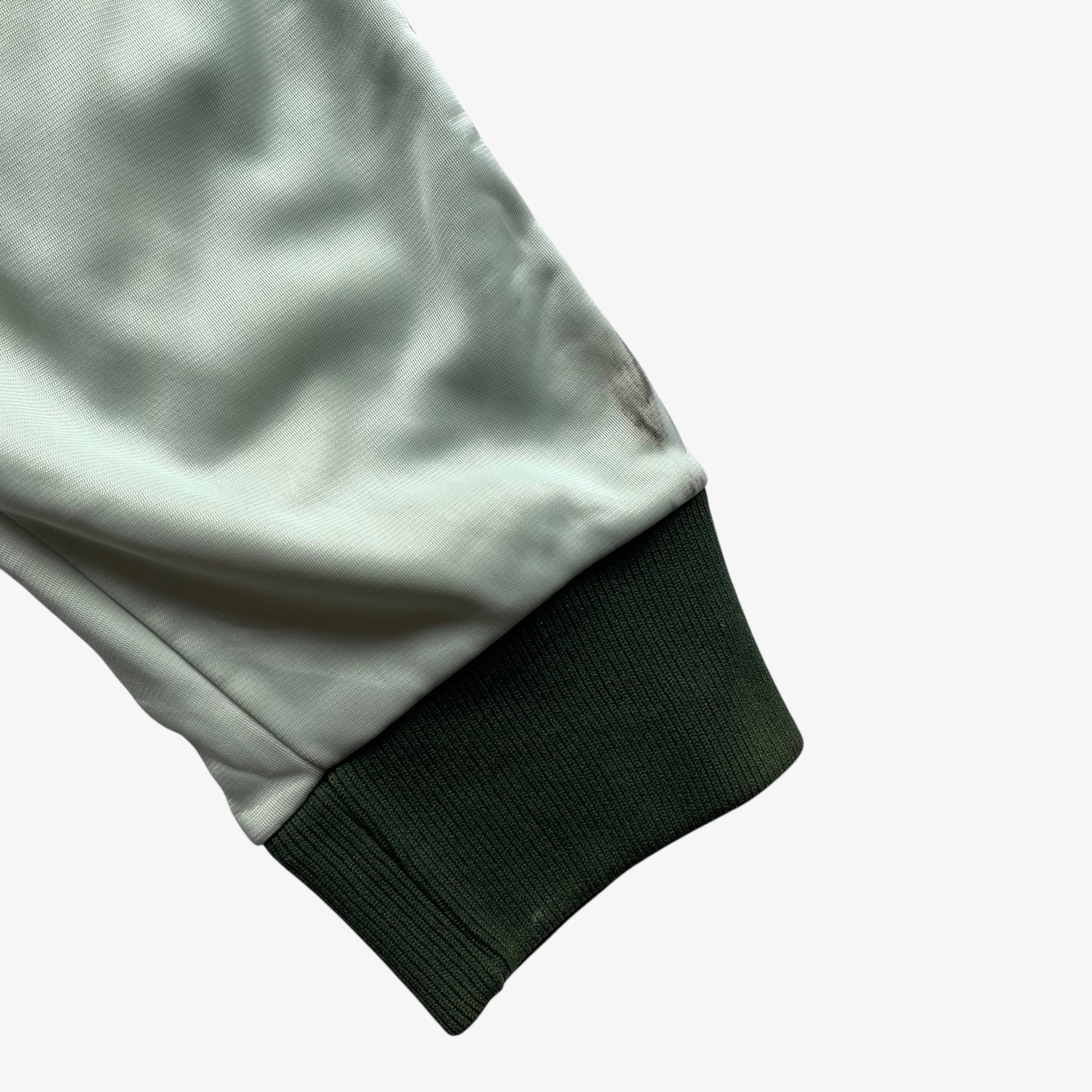 Cuff of men's vintage 70s Adidas ATP Keyrolan green track jacket.